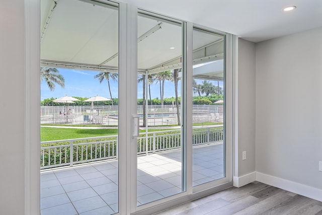 doorway to outside featuring light hardwood / wood-style flooring