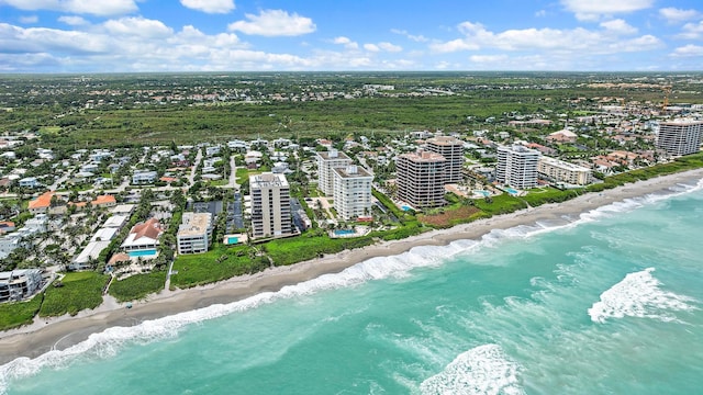 drone / aerial view with a water view and a view of the beach