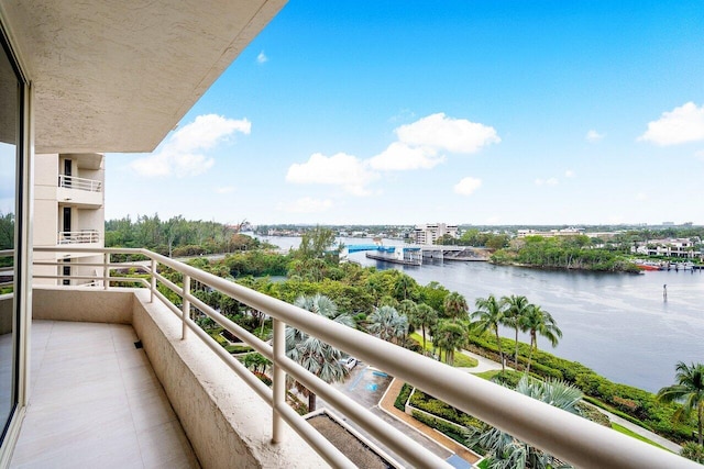 balcony featuring a water view