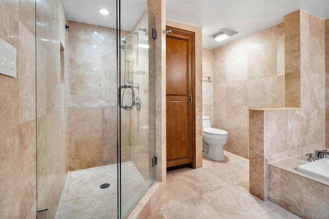 bathroom with toilet, independent shower and bath, and tile walls