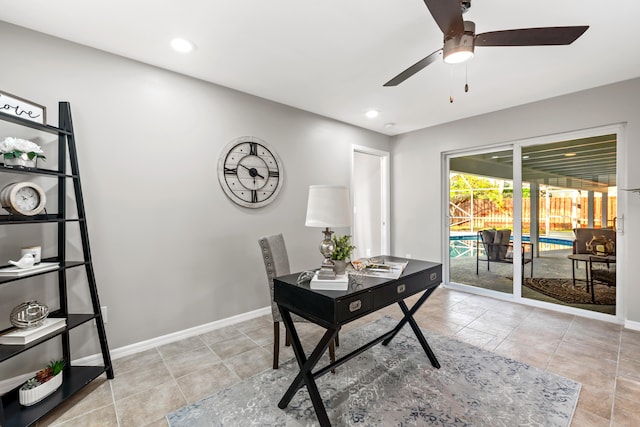 tiled office featuring ceiling fan