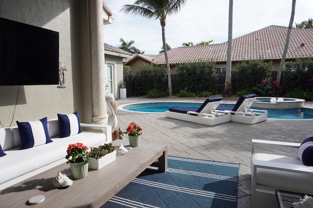 view of pool featuring a patio area, an outdoor hangout area, and an in ground hot tub