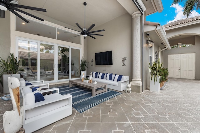 view of patio / terrace featuring an outdoor living space, french doors, and ceiling fan