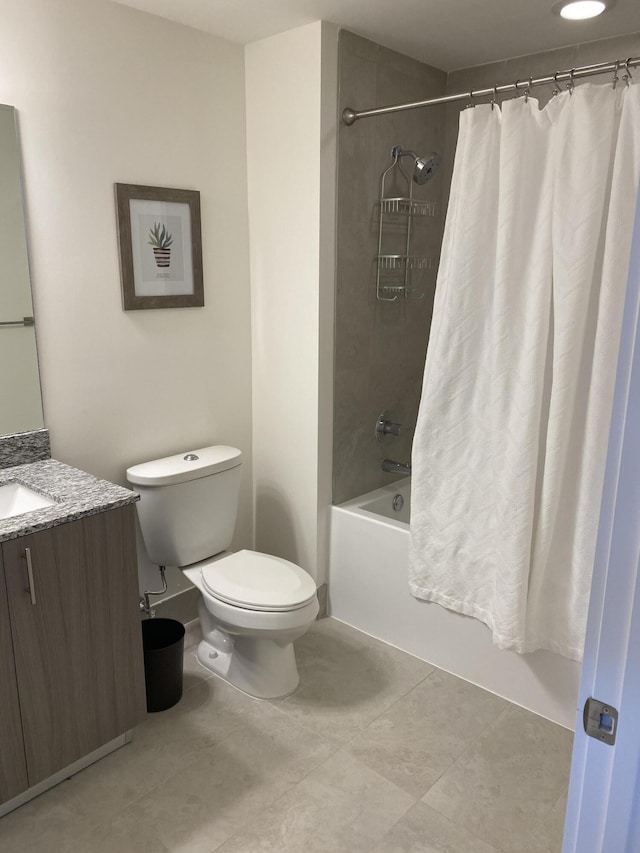 full bathroom featuring vanity, shower / bath combination with curtain, tile patterned floors, and toilet