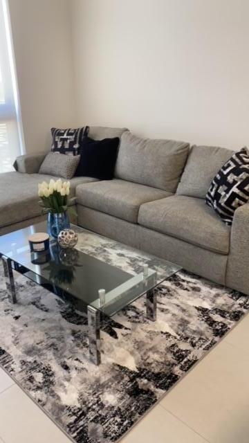 living room with tile patterned flooring