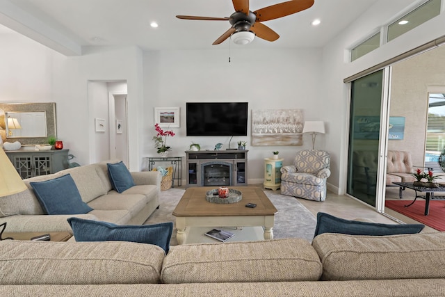 living room with light wood-type flooring and ceiling fan