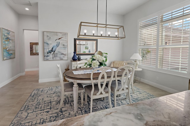 dining area with an inviting chandelier