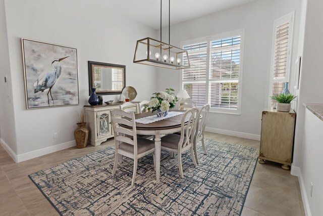 dining space with a notable chandelier