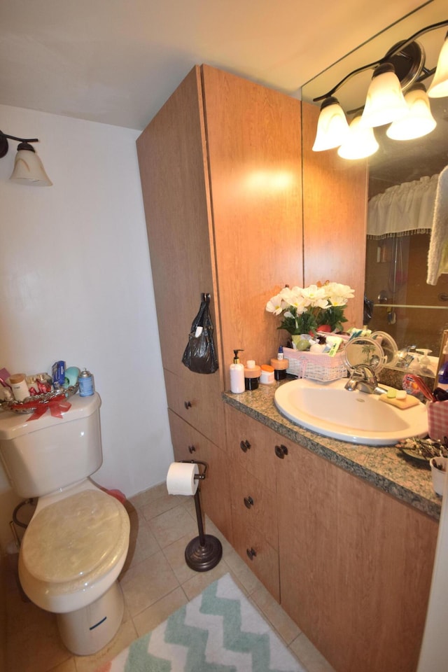 bathroom with tile patterned flooring, sink, and toilet