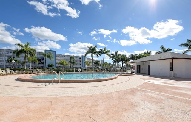 view of swimming pool featuring a patio area