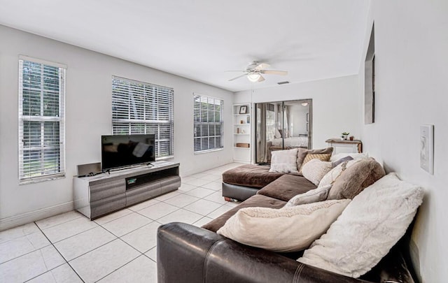 living room featuring ceiling fan and light tile patterned floors