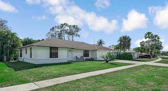 ranch-style home featuring a front yard