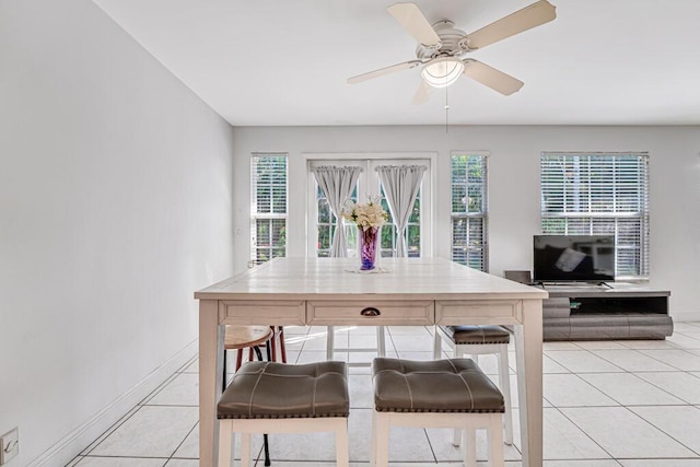 kitchen featuring light tile patterned floors, a wealth of natural light, and ceiling fan