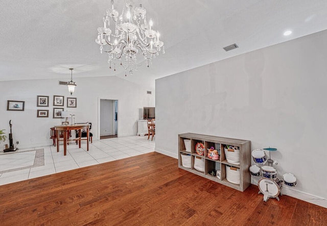 interior space featuring light hardwood / wood-style flooring and vaulted ceiling