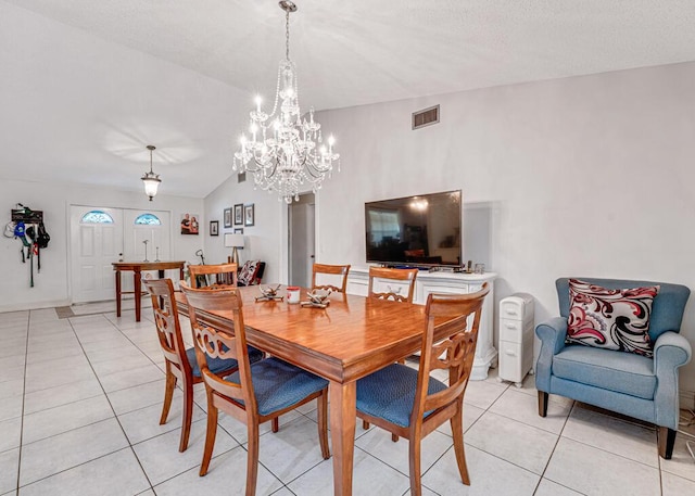 tiled dining room with lofted ceiling