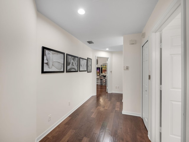 hall featuring dark wood-type flooring