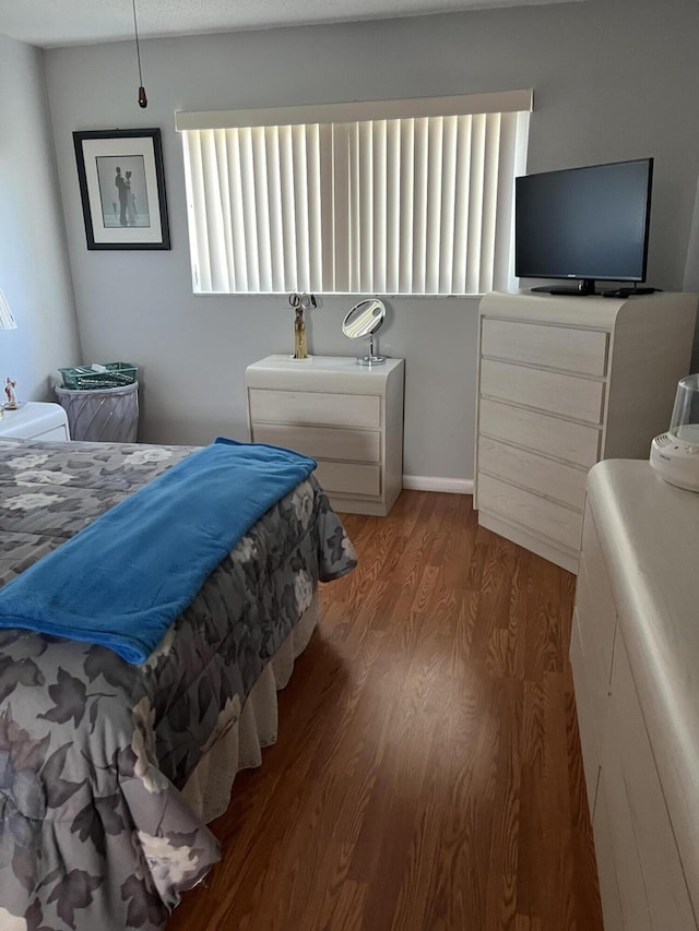 bedroom featuring wood-type flooring