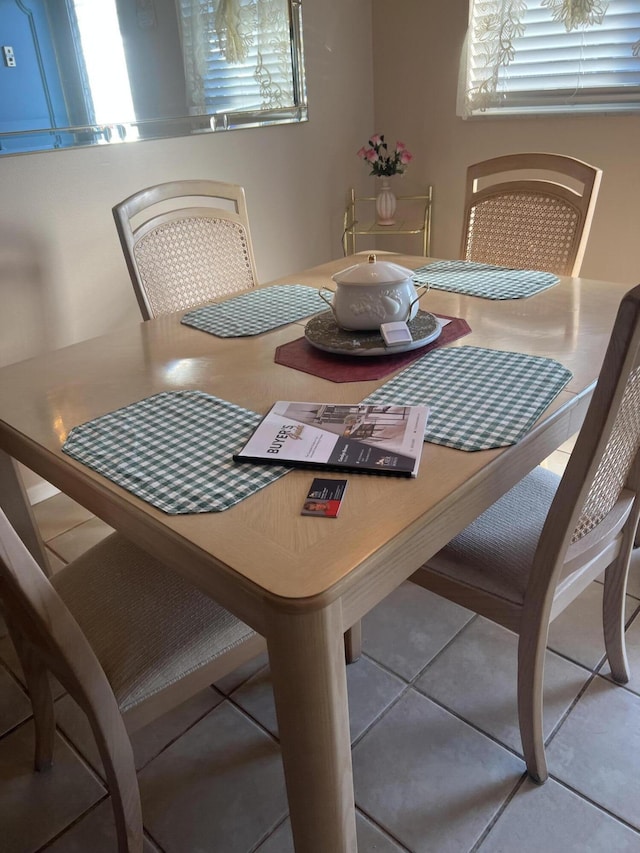 dining room featuring light tile patterned floors