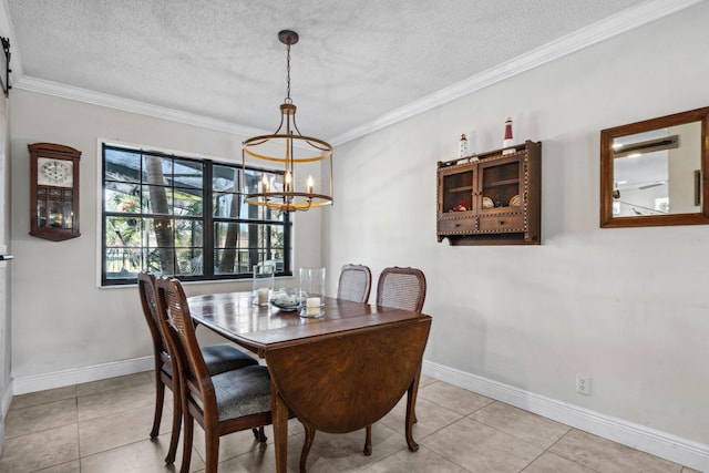 dining area featuring crown molding, light tile patterned floors, and a textured ceiling