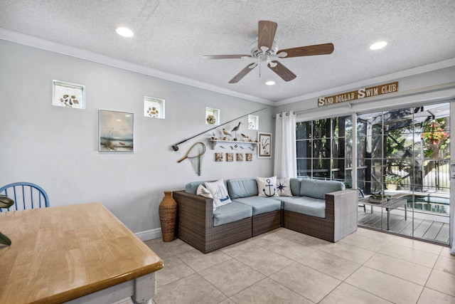 tiled living room with crown molding, ceiling fan, and a textured ceiling