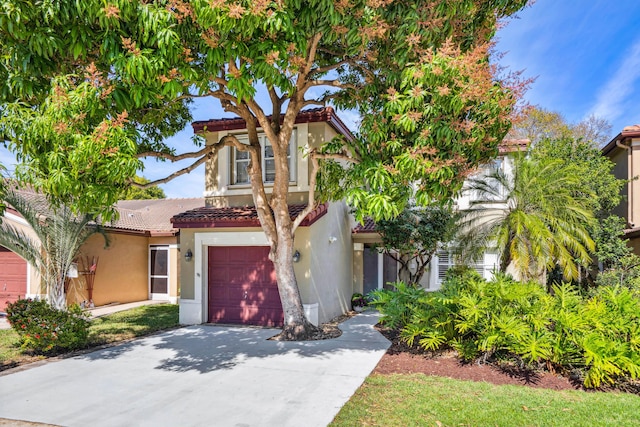 mediterranean / spanish-style house featuring a garage