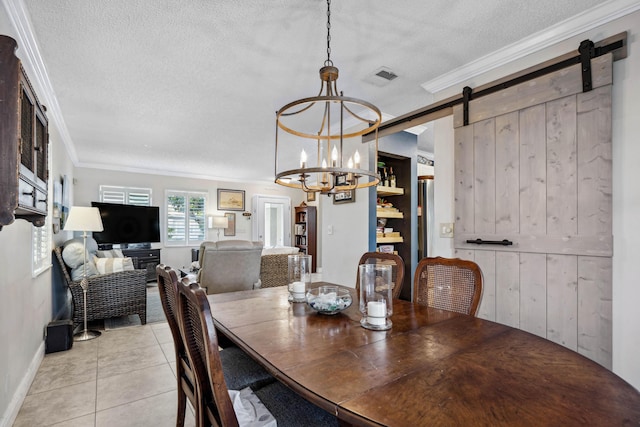 dining area with crown molding, a barn door, and a textured ceiling