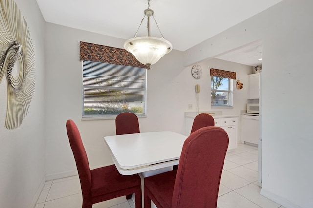 dining space featuring light tile patterned floors