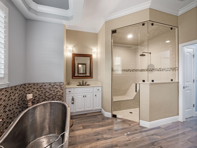 bathroom with ornamental molding, wood-type flooring, and a shower with shower door