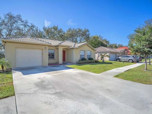 view of front of home featuring a garage and a front yard