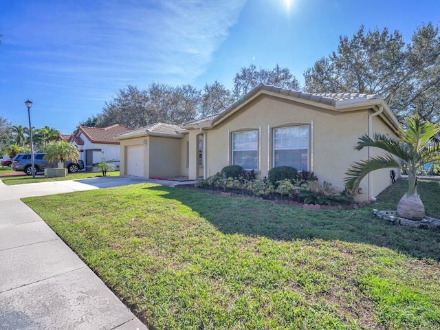 single story home with a garage and a front yard