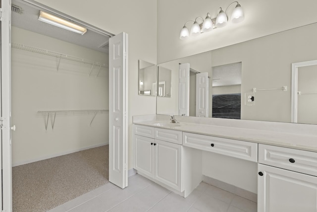 bathroom with vanity and tile patterned floors