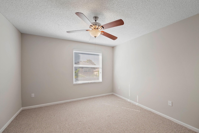 unfurnished room featuring ceiling fan, a textured ceiling, and carpet