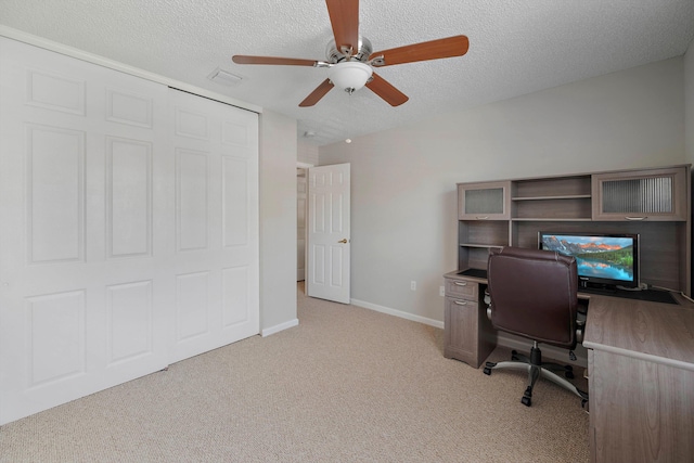 office with ceiling fan, light carpet, and a textured ceiling