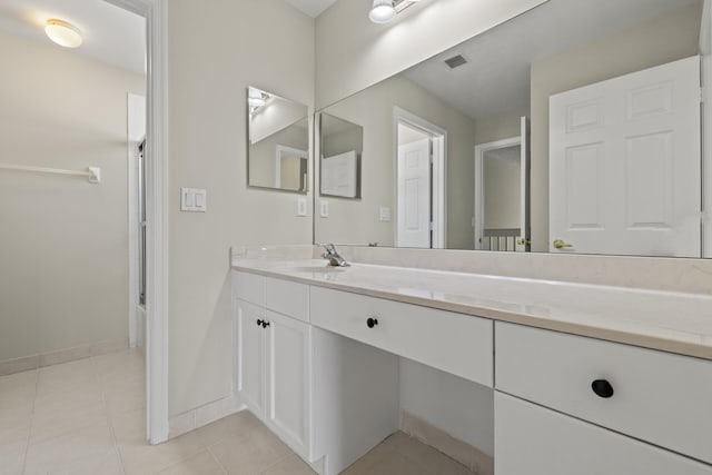 bathroom featuring tile patterned floors and vanity