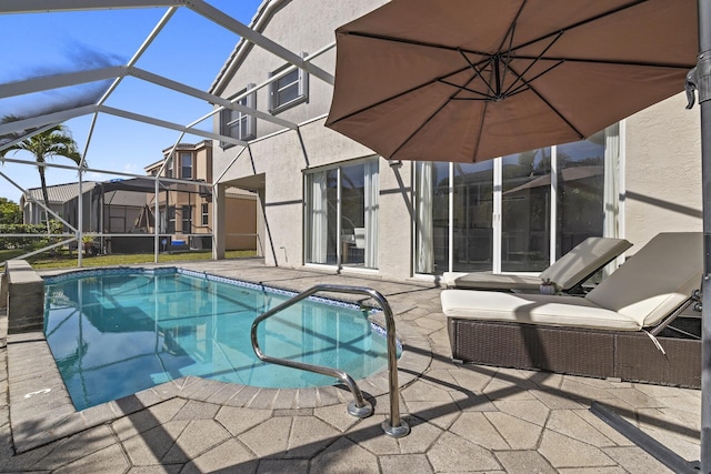 view of pool featuring a patio and a lanai