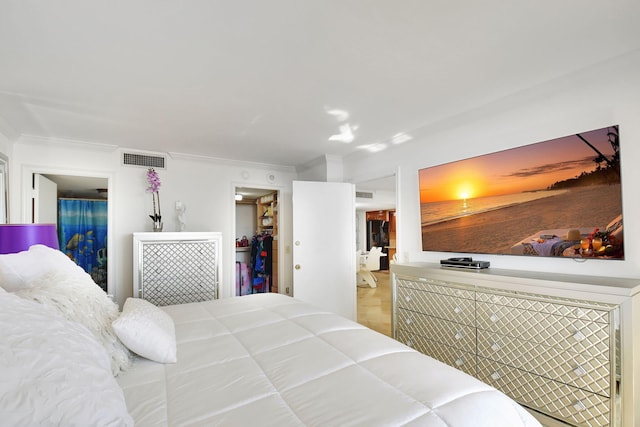 bedroom with ornamental molding