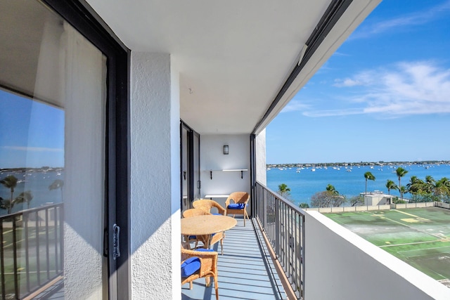 balcony featuring a water view