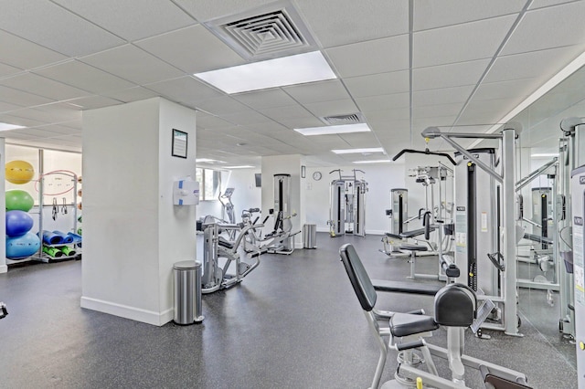 workout area featuring a paneled ceiling