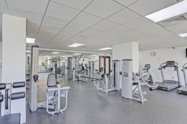 workout area featuring a drop ceiling