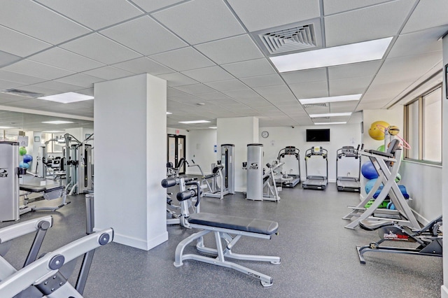 workout area featuring a paneled ceiling