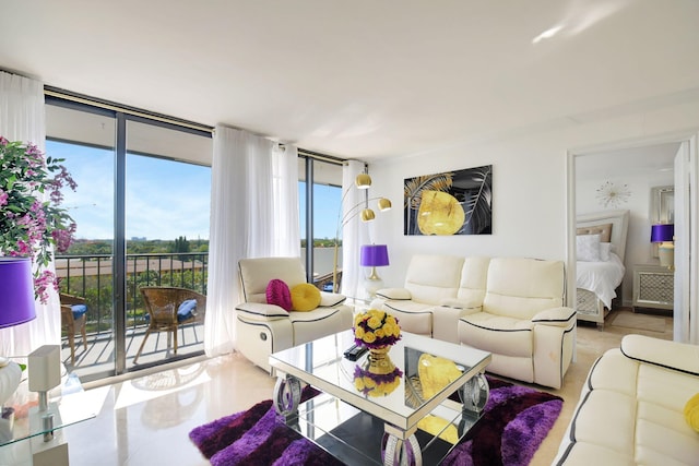 living room featuring floor to ceiling windows