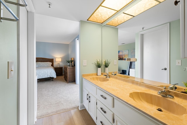 bathroom featuring vanity and hardwood / wood-style flooring