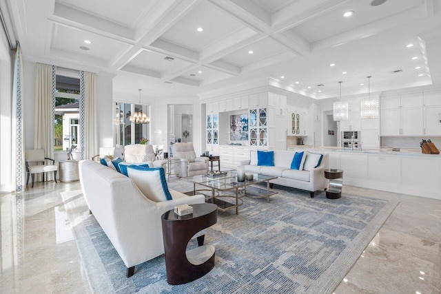 living room featuring crown molding, beam ceiling, a towering ceiling, coffered ceiling, and a chandelier