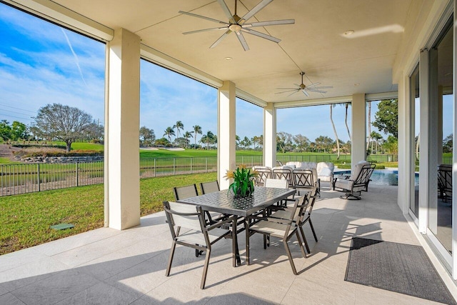 sunroom / solarium with ceiling fan