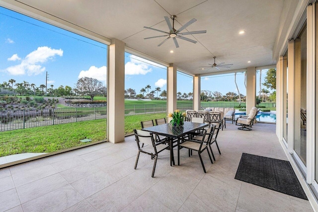 sunroom / solarium with ceiling fan