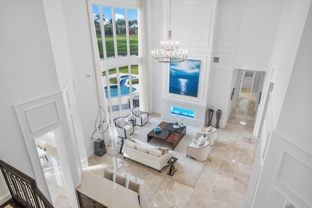 living room with an inviting chandelier