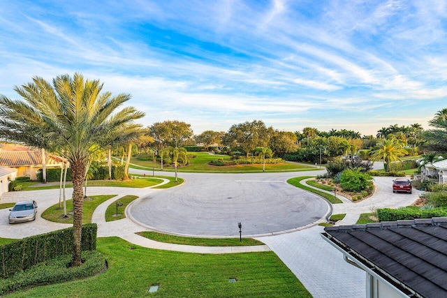 view of property's community with a lawn