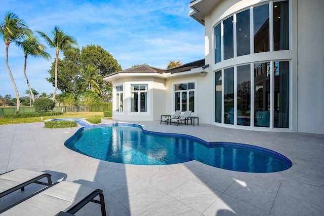 view of swimming pool featuring a patio area