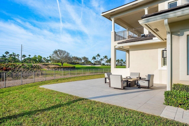 view of patio featuring a balcony