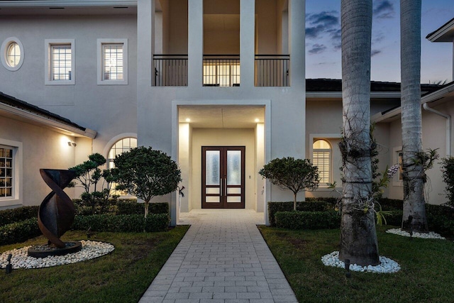 exterior entry at dusk with french doors